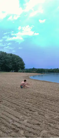 Man does a cartwheel on the beach