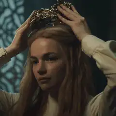 Woman placing a crown on her head