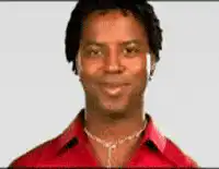 Man in red shirt smiling and laughing