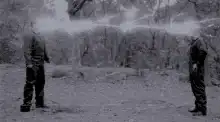 Two men breathing steam in winter