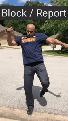 Man doing martial arts moves Block Report