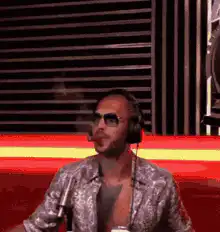 Man in sunglasses smoking and laughing