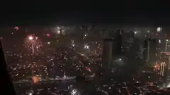 Fireworks over city skyline at night