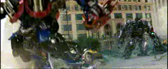 Optimus Prime smashes Decepticon