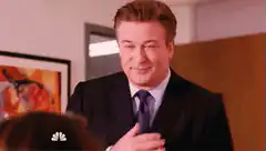 Alec Baldwin as Donald Trump clapping