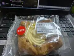 custard cream danish pastry on laptop