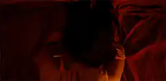 Couple kissing in bed
