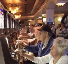 elderly people playing slot machines