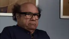 Danny DeVito skeptical face