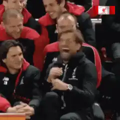 Jurgen Klopp laughing and clapping on the bench
