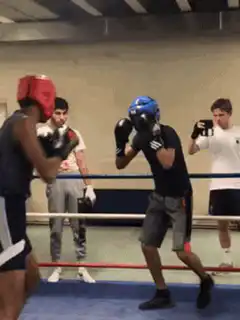 Boxers clinch in the ring