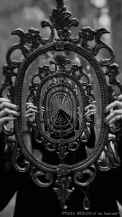 Ornate mirror reflecting a tunnel
