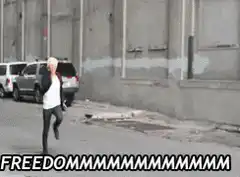 Blonde man dancing in street