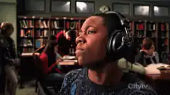 Boy listening to music in library