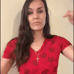 Woman in red shirt pointing down