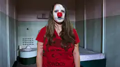 Clown woman in prison cell