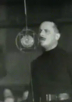 Joseph Goebbels speaking into a microphone