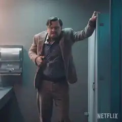Man in bathroom looking up