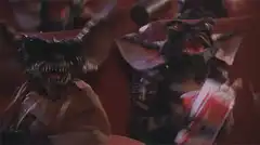 Gremlins eating popcorn in theater