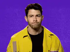 Nick Jonas waving hello