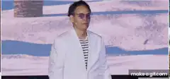 Man in white jacket laughing