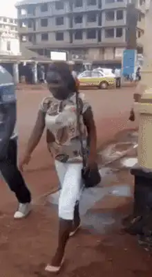 Woman and man walking on street