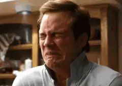 Man crying intensely