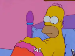 Homer Simpson in bed looking confused