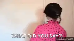 Person in pink polka dot shirt turns around