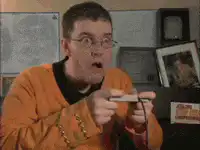 Man playing video game with shocked expressions