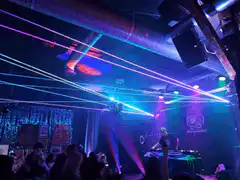 DJ performing with laser lights