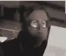 Man with glasses staring in shock