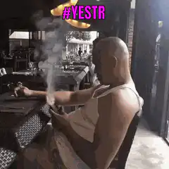 Bald man smoking cigar with smoke