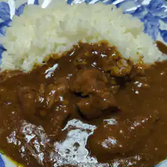 curry and rice on blue plate