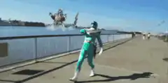Green Ranger dancing on bridge