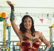 Wonder Woman throws a dart at a carnival