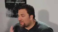 Man Force Feeds Another Man a Drink