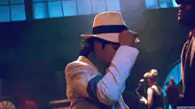 Michael Jackson adjusting his fedora