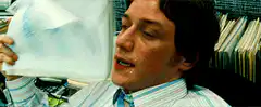 James McAvoy sweating while reading a document