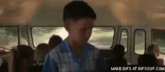 Sad boy on school bus
