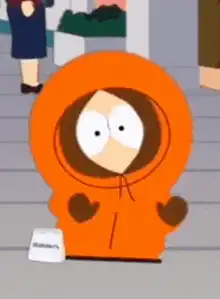 Cartman in orange hoodie with Waldo's book