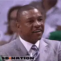 Doc Rivers nodding and smiling