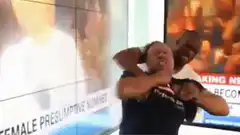 Man rips shirt off on news set