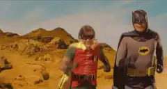 Batman and Robin running from the Batmobile