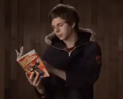 Evan Peters reading a comic book