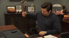 Ron Swanson smashes phone with hammer