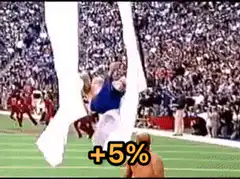 Naked man jumps through banner at football game