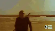 Viking walking on beach with shield