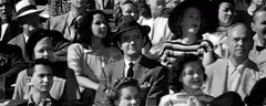 black and white crowd laughing