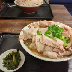 Bowl of ramen with pork and green onions